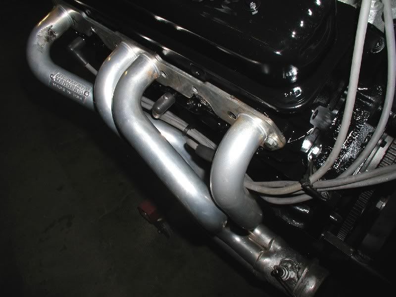 Spark plug wire looms...under header or not? Message